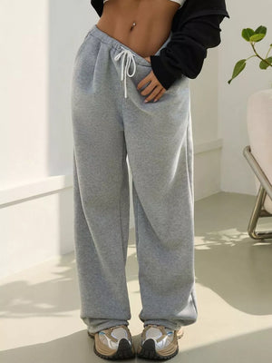 Gray wide-leg maternity joggers with drawstring waist and pockets.