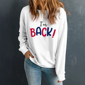 White crewneck sweatshirt with I'm Back! graphic in red and blue text