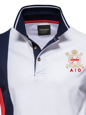 Colorblock polo shirt with crest detail and navy collar.