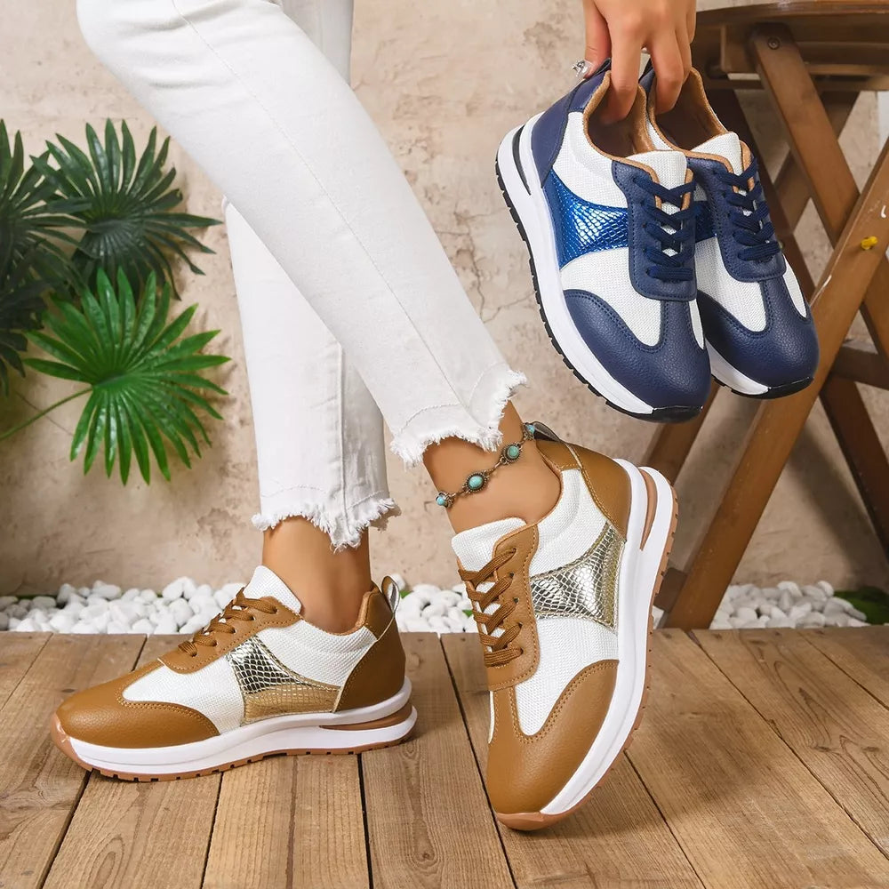 Chic lace-up sneakers in light brown and blue with textured accents and white mesh panels.