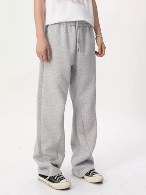 Relaxed fit grey sweatpants with adjustable drawstring waist and wide leg