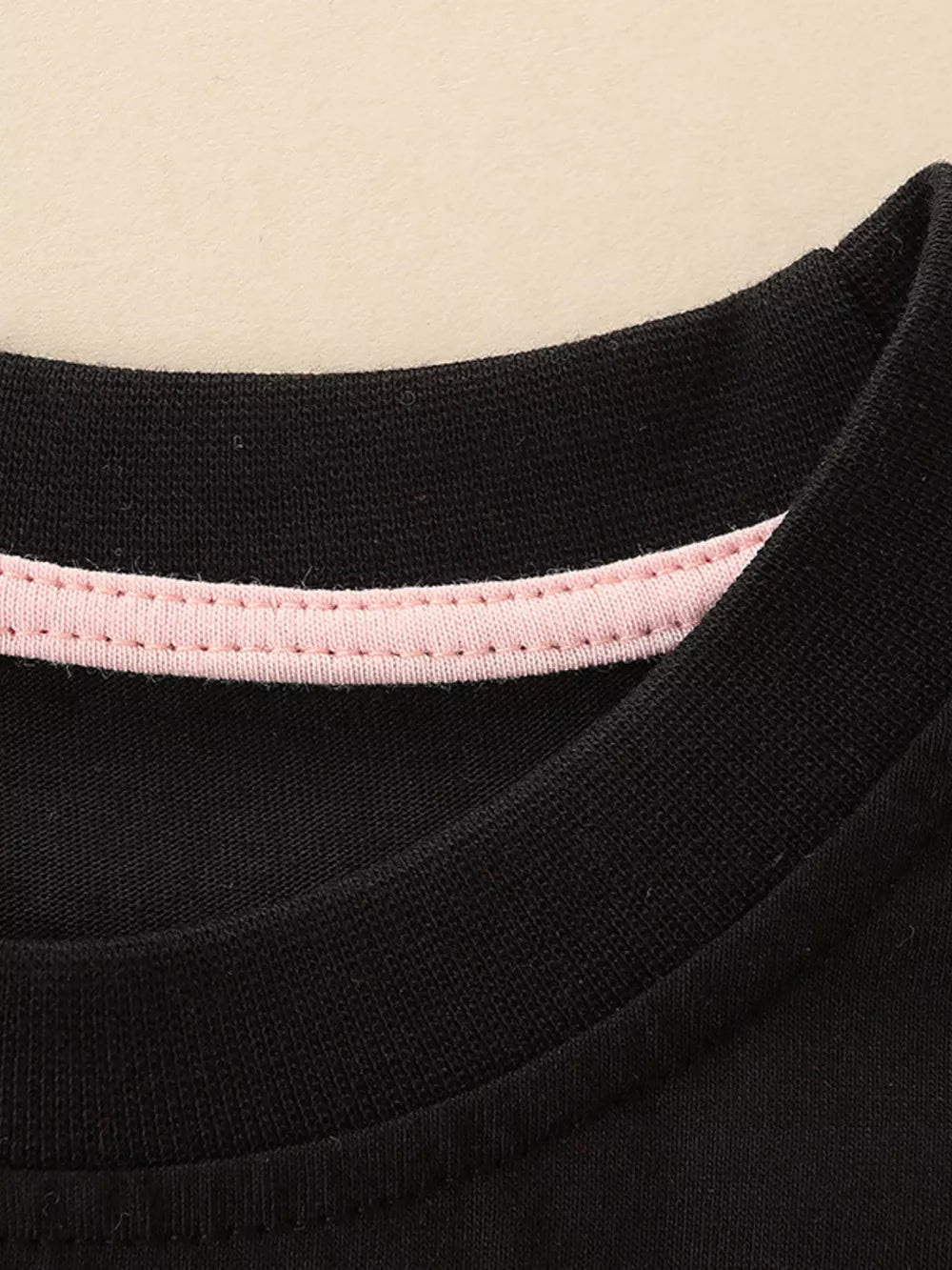 Black cotton toddler t-shirt with pink trim detail on neckline