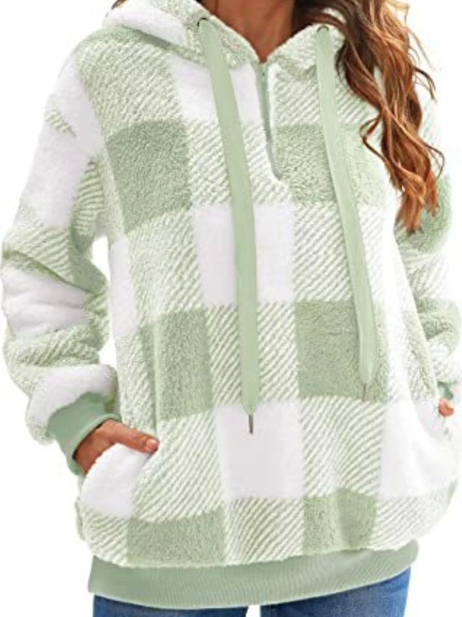 Green and white plaid sherpa hoodie with drawstring and front pocket.