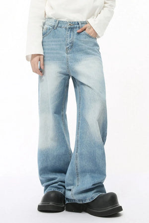 Light wash balloon leg jeans with faded detailing and a wide leg silhouette.
