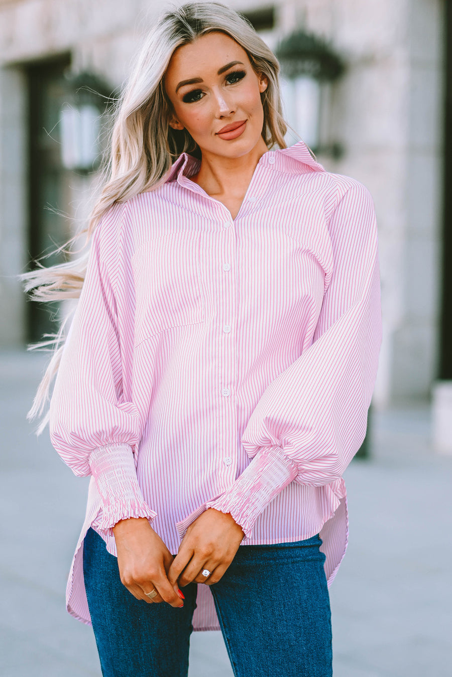 Blush pink pinstripe blouse with balloon sleeves and smocked cuffs.