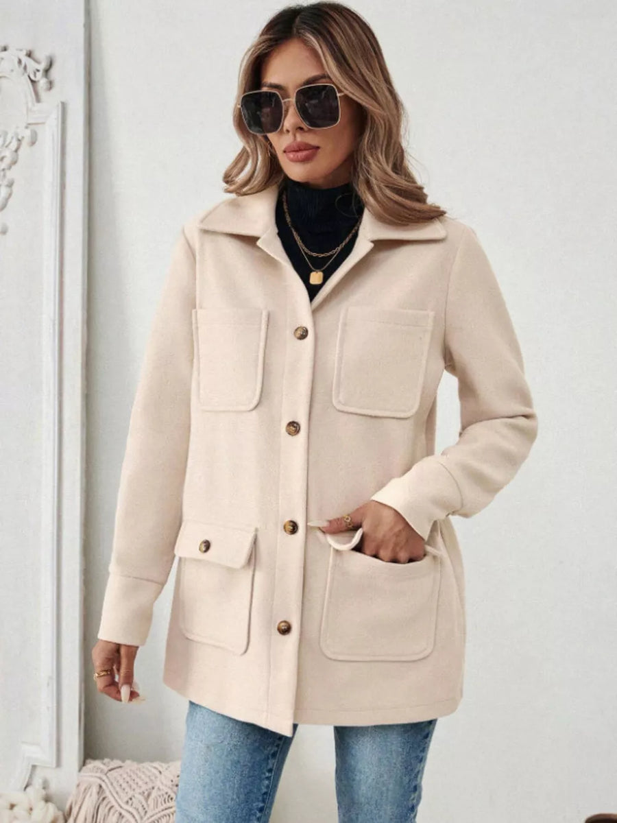 Apricot button-front trench coat with four pockets and button closure.