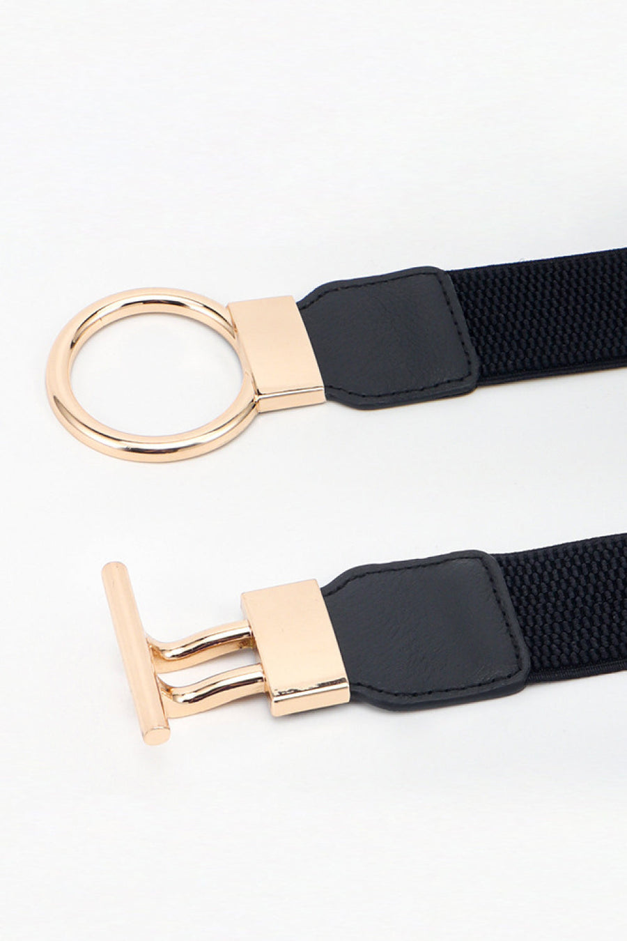 Black elasticated belt with gold ring buckle and T-bar closure detail