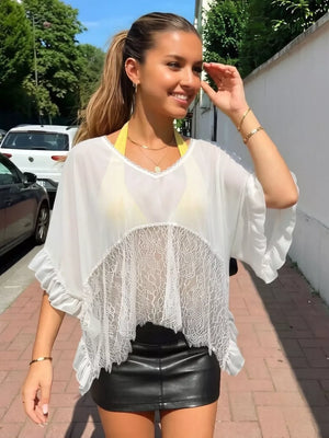 White sheer flowing cover-up with lace trim and ruffled sleeves, V-neck.