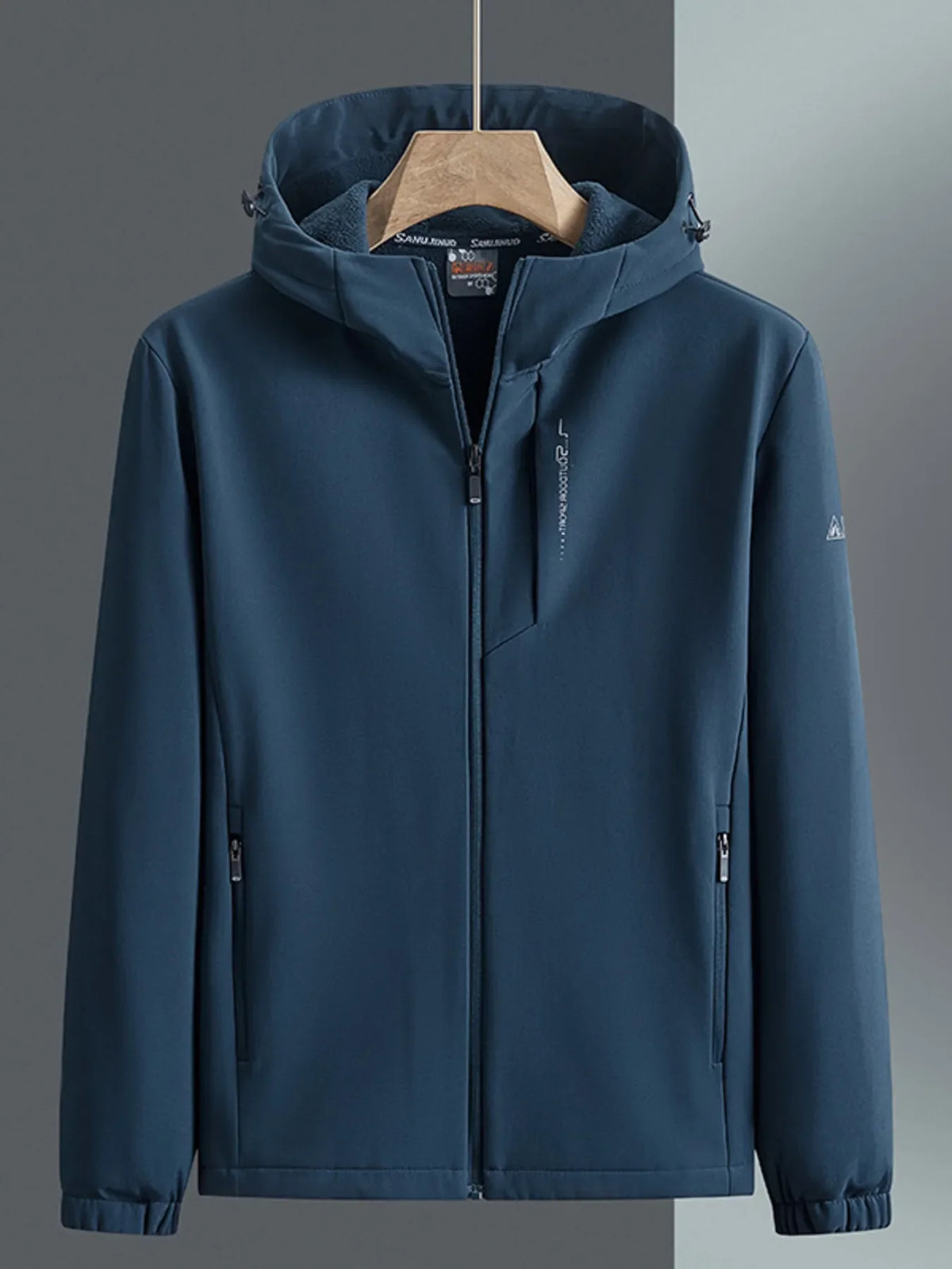 Men's hooded windbreaker in Peacock Blue with zippered pockets and subtle sleeve logo.