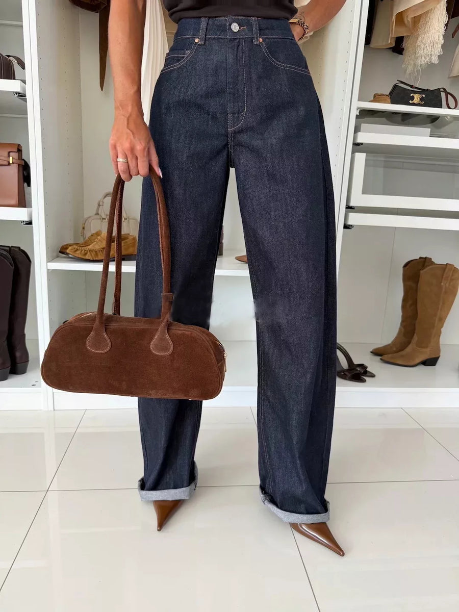 Dark navy high-waisted wide-leg jeans with a cotton blend denim fabric and cuffed hems.