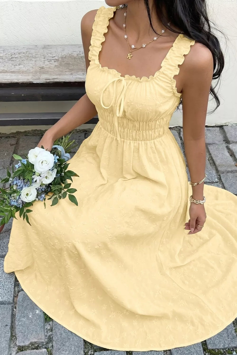 Yellow smocked floral maxi dress with frill straps and tie front.