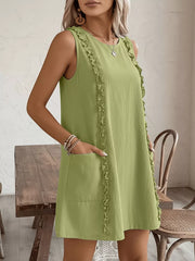 Yellow-Green sleeveless dress with frill detail and pockets.