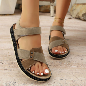 Two-toned brown open-toe platform sandals with adjustable straps and cross-over detailing.