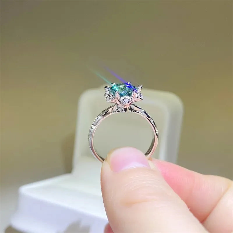 Sterling silver ring with moissanite solitaire and halo, intricate band detail