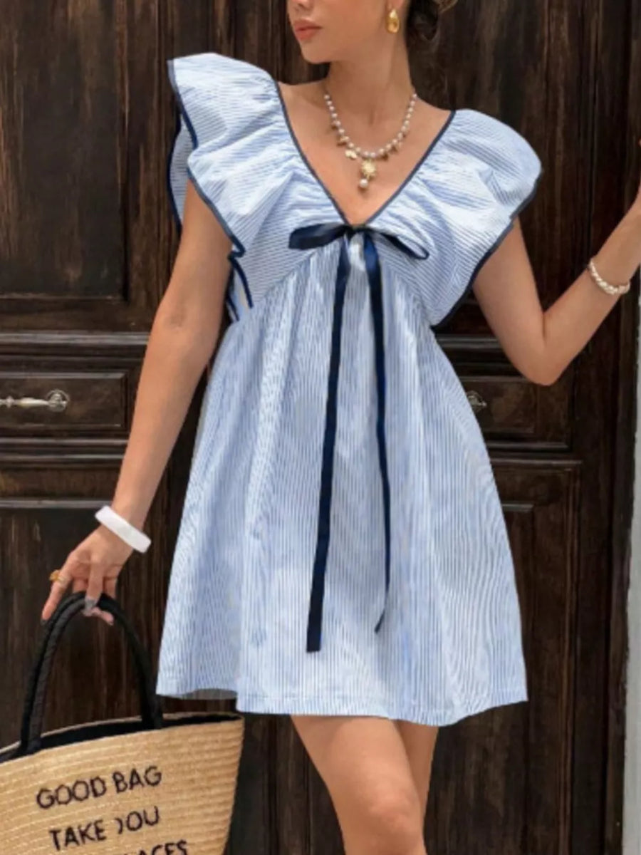 Blue striped mini dress with ruffled sleeves, V-neck, and bow detail.