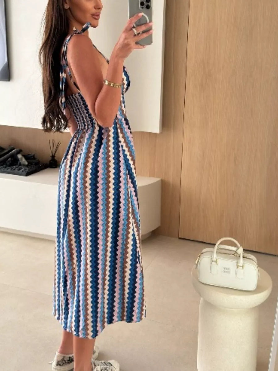 Floral tie-strap midi dress with smocked bodice in a colorful stripe pattern.