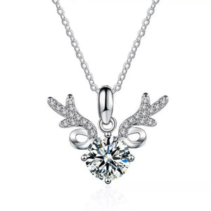 Sterling silver necklace with a moissanite diamond and antler charm.