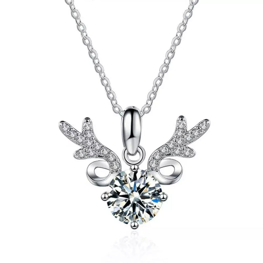 Sterling silver necklace with a moissanite diamond and antler charm.