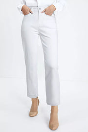 Chic white high-waisted straight leg cotton jeans with ankle length and raw hem.