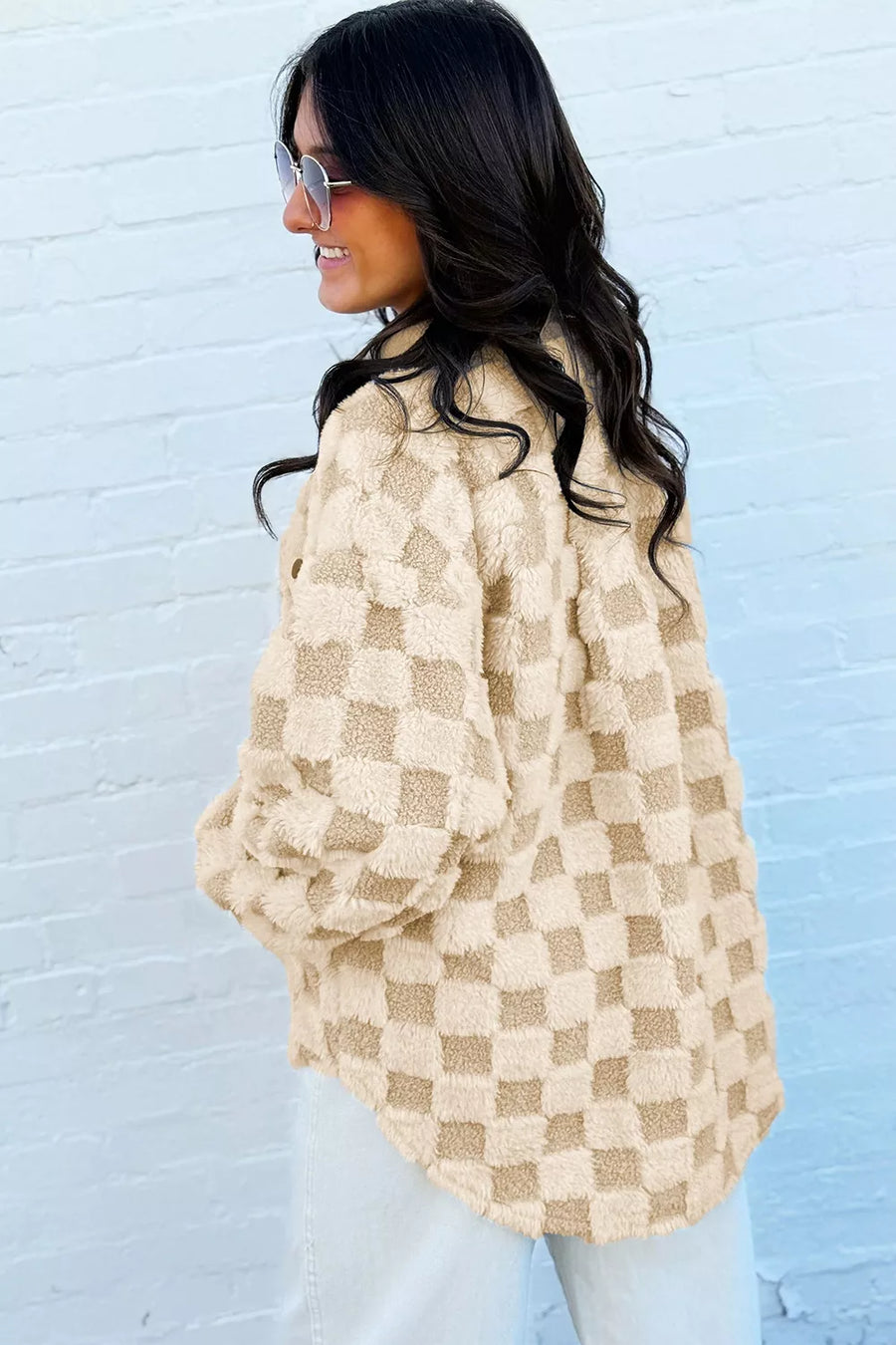 tan shacket featuring buttoned and checked
