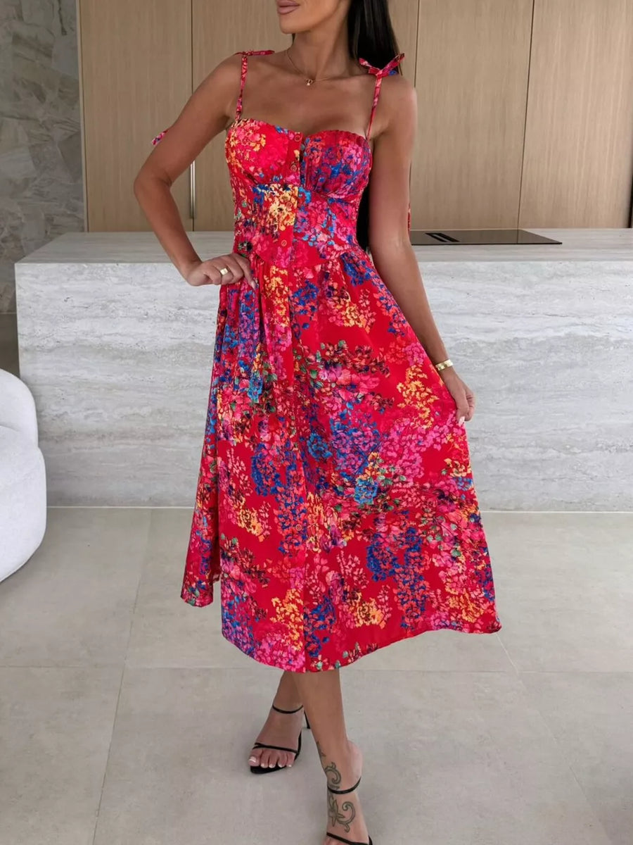 Floral tie-strap midi dress in scarlet with a vibrant floral print, sweetheart neckline, and A-line skirt.