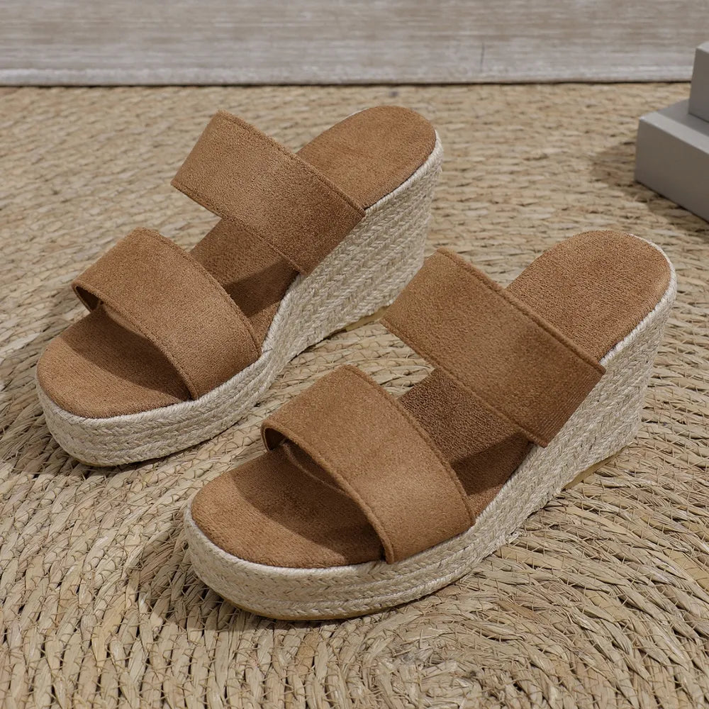 Camel suede platform wedge slides with rope-wrapped espadrille detail.