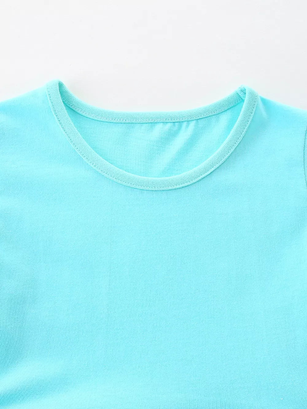 Baby blue cotton blend dress with round neckline and contrast trim.