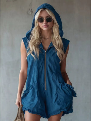 Blue hooded sleeveless romper with ruffled pockets and zipper front.