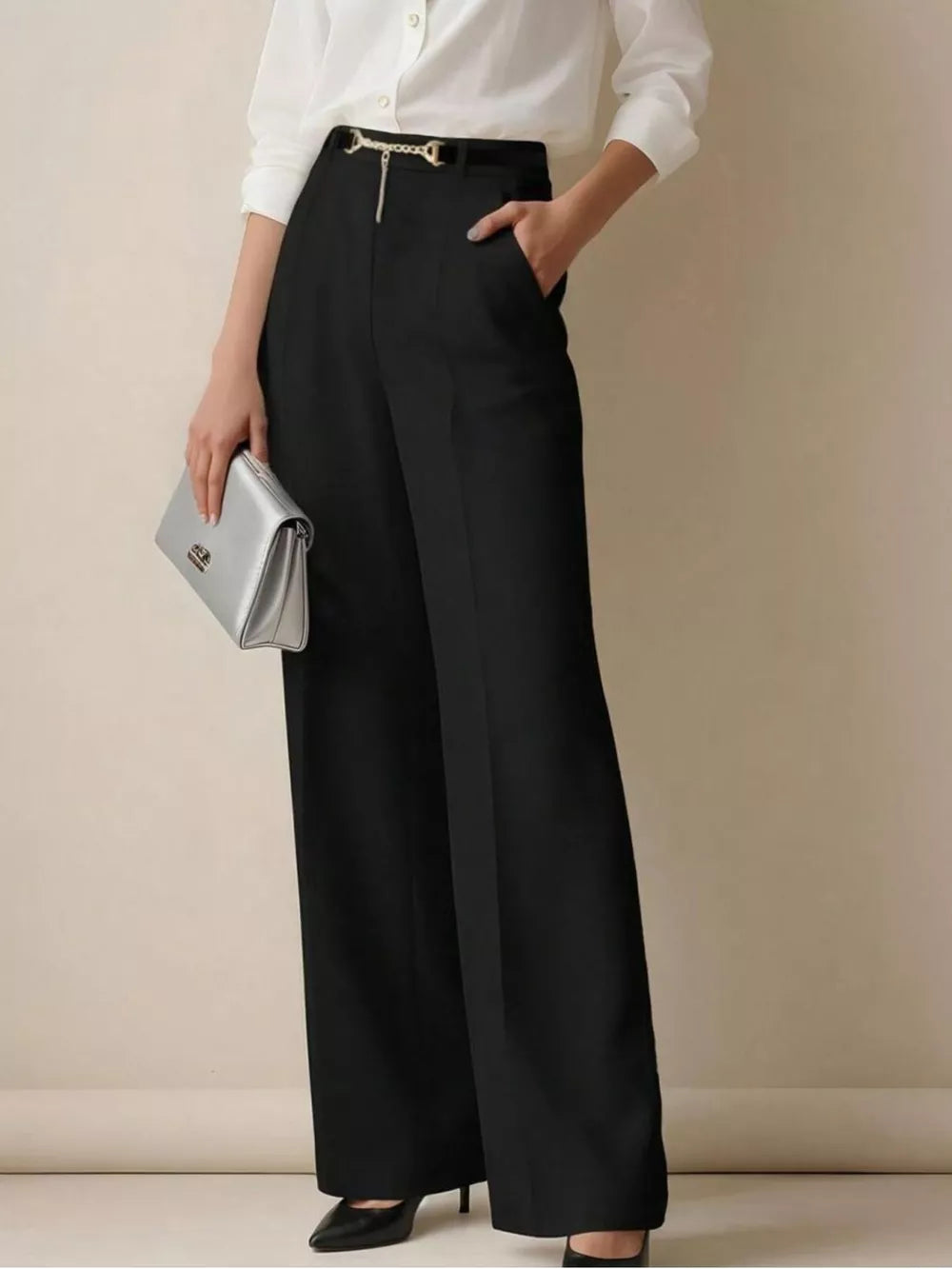 Black wide-leg high-waist maternity trousers with a gold chain belt detail.