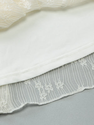 White lace backless mini dress with asymmetrical hem detail