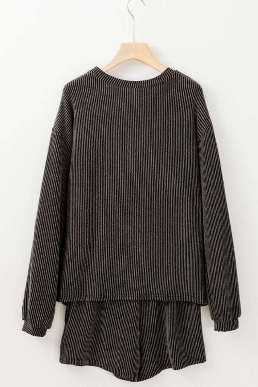 Dark gray ribbed lounge set with a graphic baseball detail, crew neck, and long sleeves.