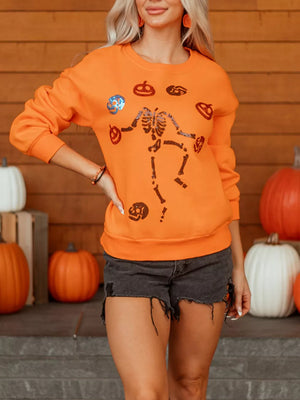 orange crewneck sweater with graphic and crew neck