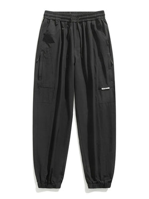 Black jogger sweatpants with drawstring, elastic cuffs, and cargo pockets.