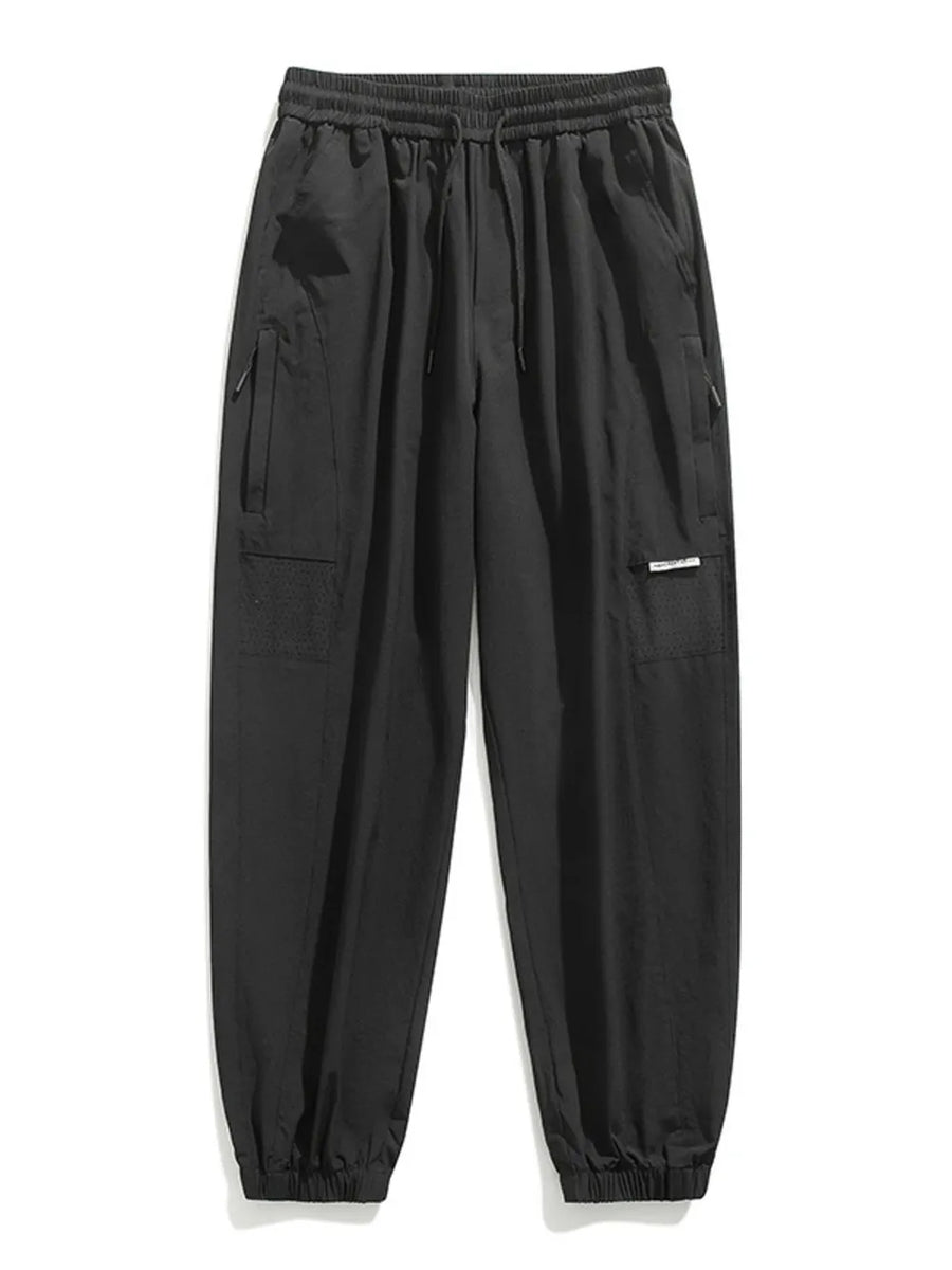 Black jogger sweatpants with drawstring, elastic cuffs, and cargo pockets.