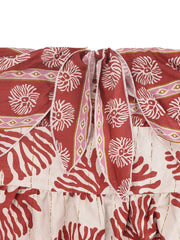 Charming Floral Tie-front Wide-leg Romper in red with white floral and coral print, tie neckline detail.