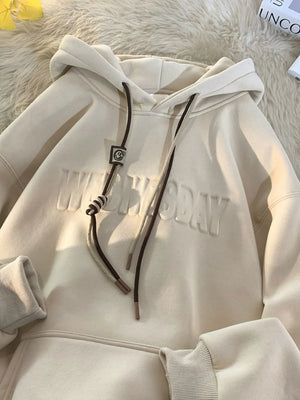 Tan cotton blend hoodie with drawstring and embossed text detail