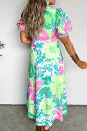 Charming floral midi dress with puff sleeves, green, pink, and blue abstract floral print, white base.