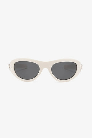 Sporty shield sunglasses in beige with dark lenses and a bow accent.