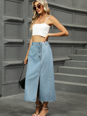 Button-front denim A-line midi skirt in medium wash with a front slit and button closure.