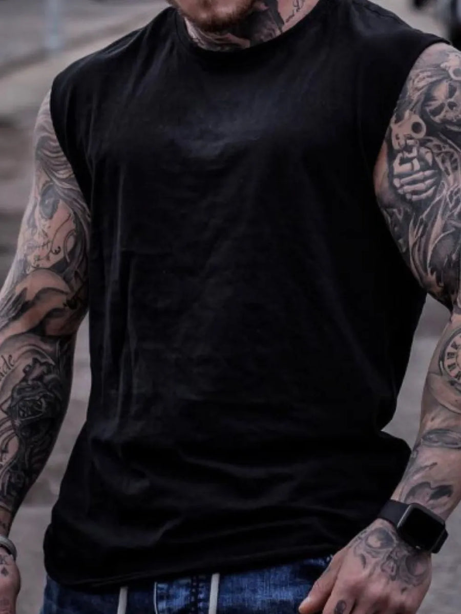 Black muscle-fit sleeveless tank top with crew neck, showing off tattooed arms.