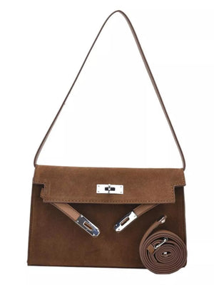 Brown suede shoulder bag with silver hardware and a top handle.