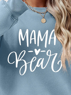 Light Blue Mama Bear graphic sweatshirt with crewneck, styled with a necklace.