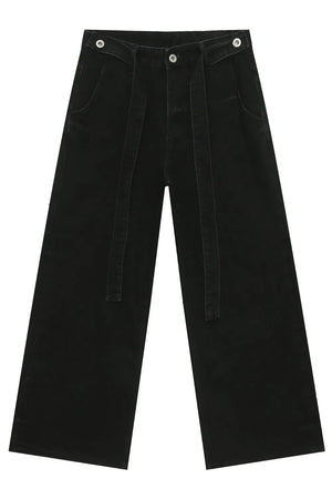 Black denim wide leg pants with tie waist and exaggerated flare.