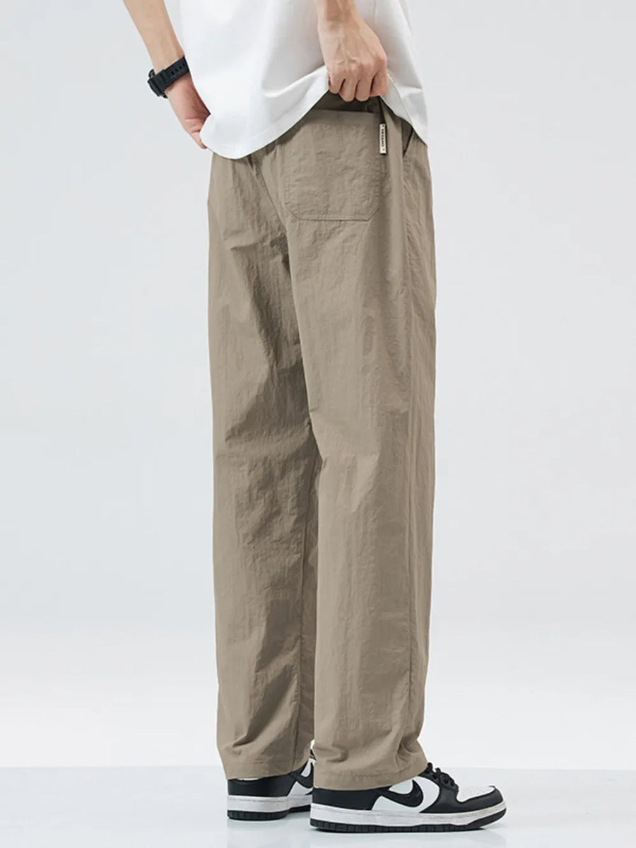 Relaxed fit wide-leg sweatpants in khaki with a back pocket detail.
