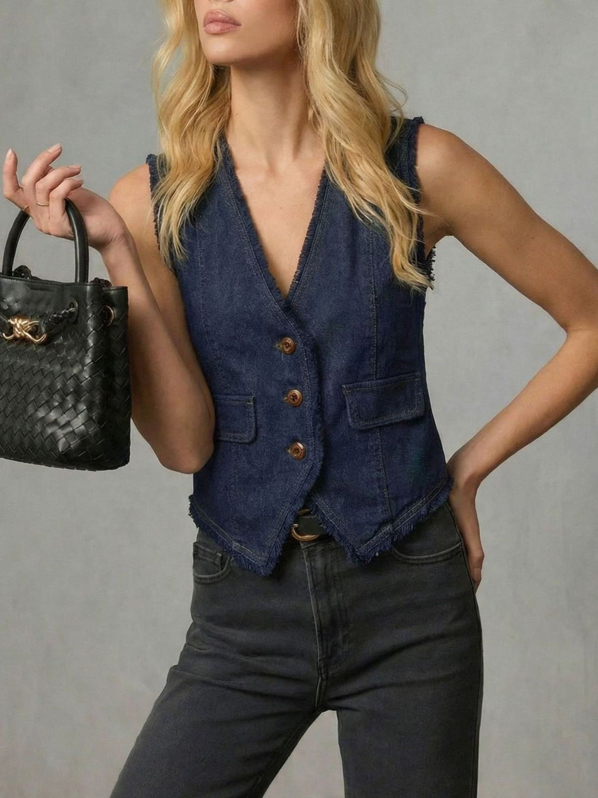 Dark navy denim vest with frayed hem and button front, v-neck, sleeveless