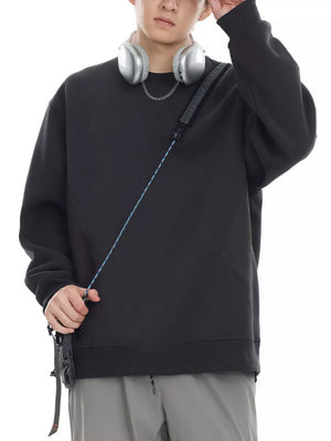 Oversized black cotton crew-neck sweatshirt with textured panel detail.