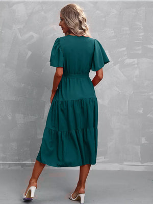Dark Green tiered midi gown with flutter sleeves and belted waist.