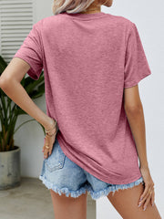 Dusty Pink heathered crew neck t-shirt with short sleeves, styled with denim shorts.