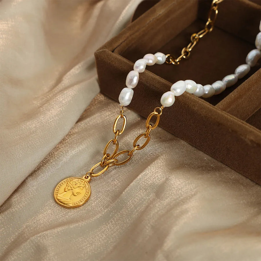 Gold pearl and coin link necklace with baroque pearls and oval chain links.