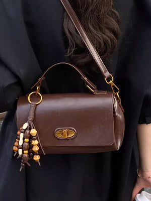 Brown pu leather flap shoulder bag with beaded tassel detail and gold hardware
